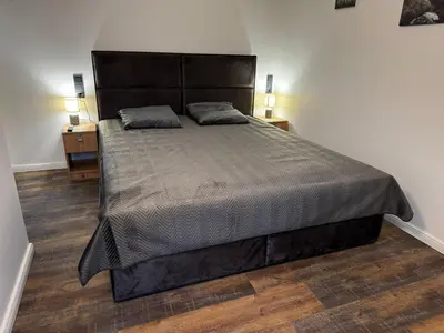 Ein Bett oder Betten in einem Zimmer der Unterkunft East-Riverside Boardinghouse