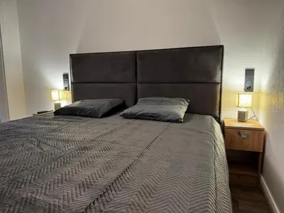 Ein Bett oder Betten in einem Zimmer der Unterkunft East-Riverside Boardinghouse