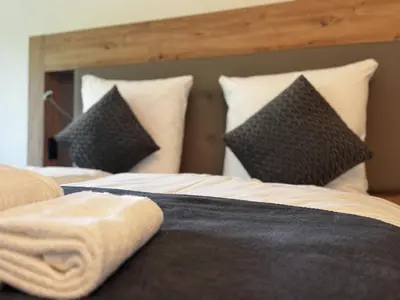 Ein Bett oder Betten in einem Zimmer der Unterkunft East-Riverside Boardinghouse