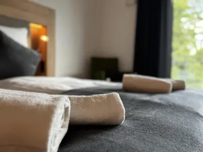 Ein Bett oder Betten in einem Zimmer der Unterkunft East-Riverside Boardinghouse