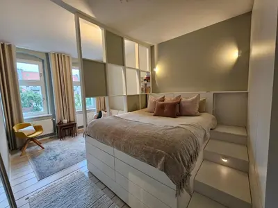 Ein Bett oder Betten in einem Zimmer der Unterkunft Bright Cozy flat near Mauerpark
