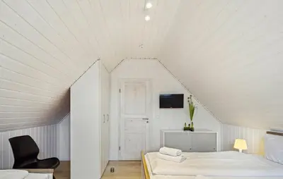 Ein Bett oder Betten in einem Zimmer der Unterkunft Haus Hafen Liebe