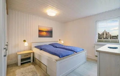 Ein Bett oder Betten in einem Zimmer der Unterkunft Haus Hafen Liebe