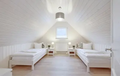 Ein Bett oder Betten in einem Zimmer der Unterkunft Hus Karibu