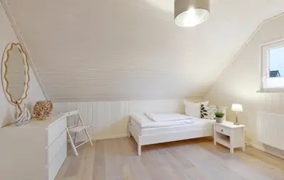 Ein Bett oder Betten in einem Zimmer der Unterkunft Hus Karibu