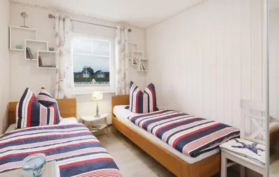 Ein Bett oder Betten in einem Zimmer der Unterkunft Hus Rehkitz