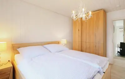 Ein Bett oder Betten in einem Zimmer der Unterkunft Hus Rehkitz