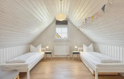 Ein Bett oder Betten in einem Zimmer der Unterkunft Ferienhaus Kuntabü