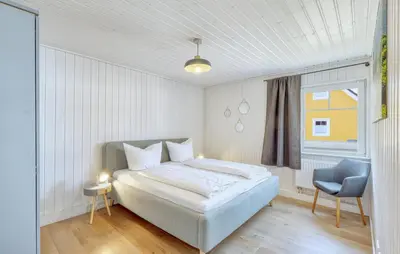 Ein Bett oder Betten in einem Zimmer der Unterkunft Ferienhaus Kuntabü