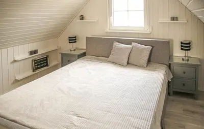 Ein Bett oder Betten in einem Zimmer der Unterkunft Lille Hus
