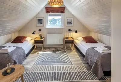 Ein Bett oder Betten in einem Zimmer der Unterkunft Nordhus