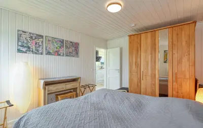 Ein Bett oder Betten in einem Zimmer der Unterkunft Onkel Toms Hütte