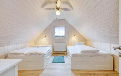 Ein Bett oder Betten in einem Zimmer der Unterkunft Villa Kunterbunt
