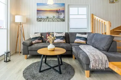 Ein Sitzbereich in der Unterkunft Komfortables Ferienhaus mit Feldblick und Hafen