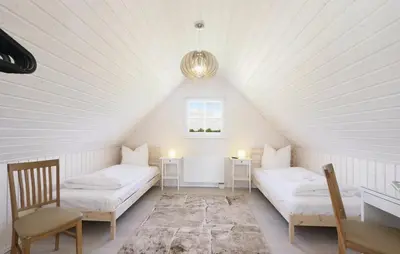 Ein Bett oder Betten in einem Zimmer der Unterkunft Hafenhaus