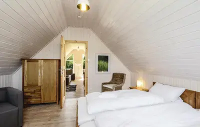 Ein Bett oder Betten in einem Zimmer der Unterkunft Haus Hafenblick