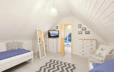 Ein Bett oder Betten in einem Zimmer der Unterkunft Haus Hafenidyll
