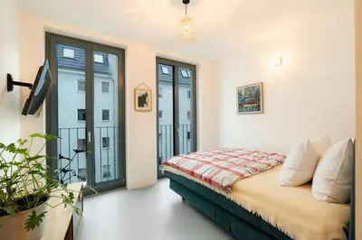 Ein Bett oder Betten in einem Zimmer der Unterkunft Heidels Design Loft & Gym Xberg