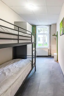 Ein Bett oder Betten in einem Zimmer der Unterkunft Etagenwohnung 110qm in der Villa Winckelmann