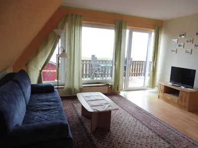 Ein Sitzbereich in der Unterkunft Apartment Appartement mit Blick auf das Wasser by Interhome