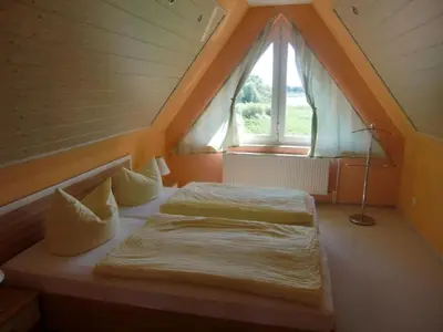 Ein Bett oder Betten in einem Zimmer der Unterkunft Apartment Nette Wohnung mit Garten- Grill und Pool by Interhome