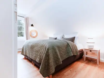 Ein Bett oder Betten in einem Zimmer der Unterkunft Holiday Home Spreewaldhaus am Landgut - Das Haupthaus by Interhome
