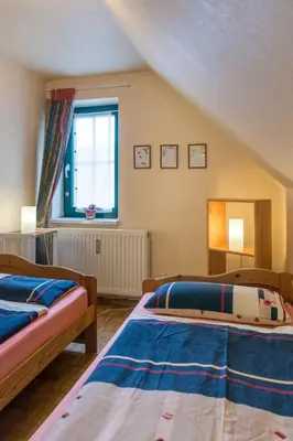 Ein Bett oder Betten in einem Zimmer der Unterkunft Holiday Home Löwenzahn by Interhome