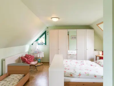 Ein Bett oder Betten in einem Zimmer der Unterkunft Holiday Home Löwenzahn mit Holu by Interhome