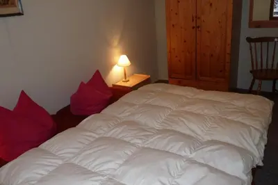 Ein Bett oder Betten in einem Zimmer der Unterkunft Ferienhaus beim Stechlinsee