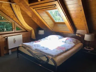 Ein Bett oder Betten in einem Zimmer der Unterkunft Blockhaus am Waldrand