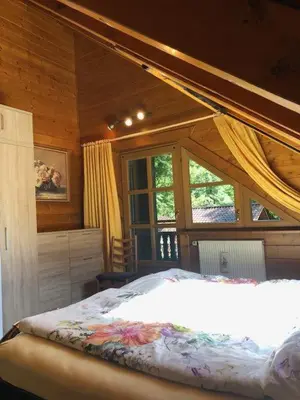 Ein Bett oder Betten in einem Zimmer der Unterkunft Blockhaus am Waldrand