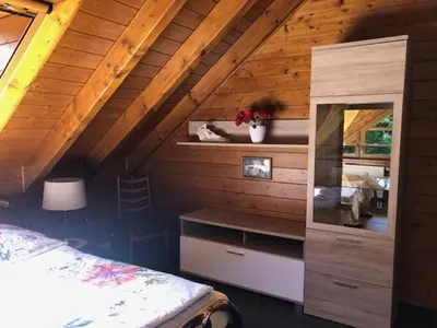 Ein Bett oder Betten in einem Zimmer der Unterkunft Blockhaus am Waldrand
