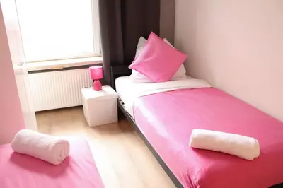 Ein Bett oder Betten in einem Zimmer der Unterkunft Stilvolle 6 Zimmer Ferienwohnung mit 2 Bädern