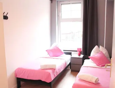Ein Bett oder Betten in einem Zimmer der Unterkunft Stilvolle 6 Zimmer Ferienwohnung mit 2 Bädern