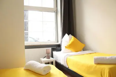 Ein Bett oder Betten in einem Zimmer der Unterkunft Stilvolle 6 Zimmer Ferienwohnung mit 2 Bädern
