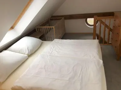Ein Bett oder Betten in einem Zimmer der Unterkunft Ferienwohnung Binenbach