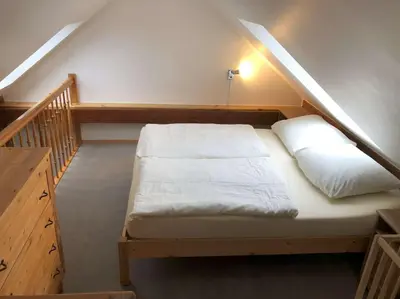 Ein Bett oder Betten in einem Zimmer der Unterkunft Ferienwohnung Kalksee