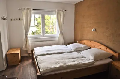 Ein Bett oder Betten in einem Zimmer der Unterkunft Die Bauernstube im Haus Sonnenaufgang - viel Platz und ebenerdig