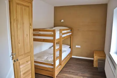 Ein Bett oder Betten in einem Zimmer der Unterkunft Die Bauernstube im Haus Sonnenaufgang - viel Platz und ebenerdig