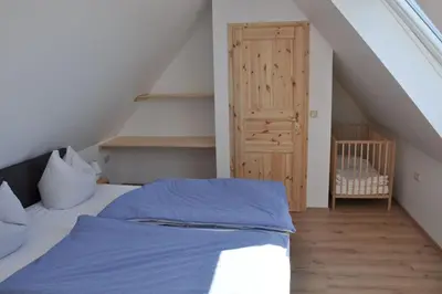 Ein Bett oder Betten in einem Zimmer der Unterkunft Kutscherwohnung im Arbeiterhaus – urigste Ferienwohnung