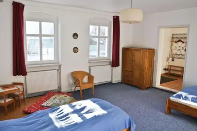 Ein Bett oder Betten in einem Zimmer der Unterkunft Hugenottenwohnung im Bauernhaus - Platz für größere Familien