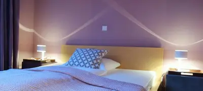Ein Bett oder Betten in einem Zimmer der Unterkunft Schloss Blankensee Gästezimmer