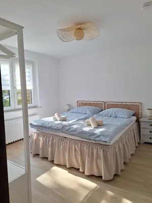 Ein Bett oder Betten in einem Zimmer der Unterkunft Stadt Land Ferienhaus