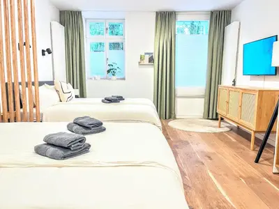 Ein Bett oder Betten in einem Zimmer der Unterkunft Katzbach - Design Flats with Self Check-In