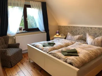 Ein Bett oder Betten in einem Zimmer der Unterkunft Auszeit Haus am See