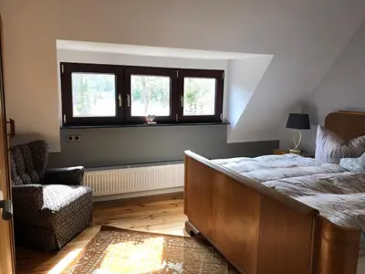 Ein Bett oder Betten in einem Zimmer der Unterkunft Auszeit Haus am See