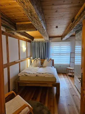 Ein Bett oder Betten in einem Zimmer der Unterkunft Ferienwohnung am Rosenbusch