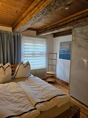 Ein Bett oder Betten in einem Zimmer der Unterkunft Ferienwohnung am Rosenbusch