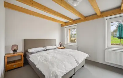 Ein Bett oder Betten in einem Zimmer der Unterkunft Annenwalde Country House 4 bedrooms with Sauna