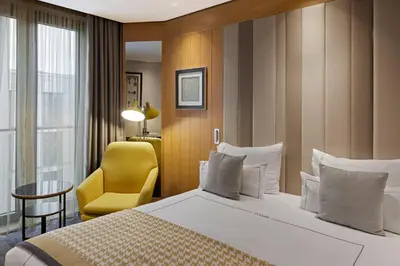 Ein Bett oder Betten in einem Zimmer der Unterkunft TITANIC Chaussee Berlin